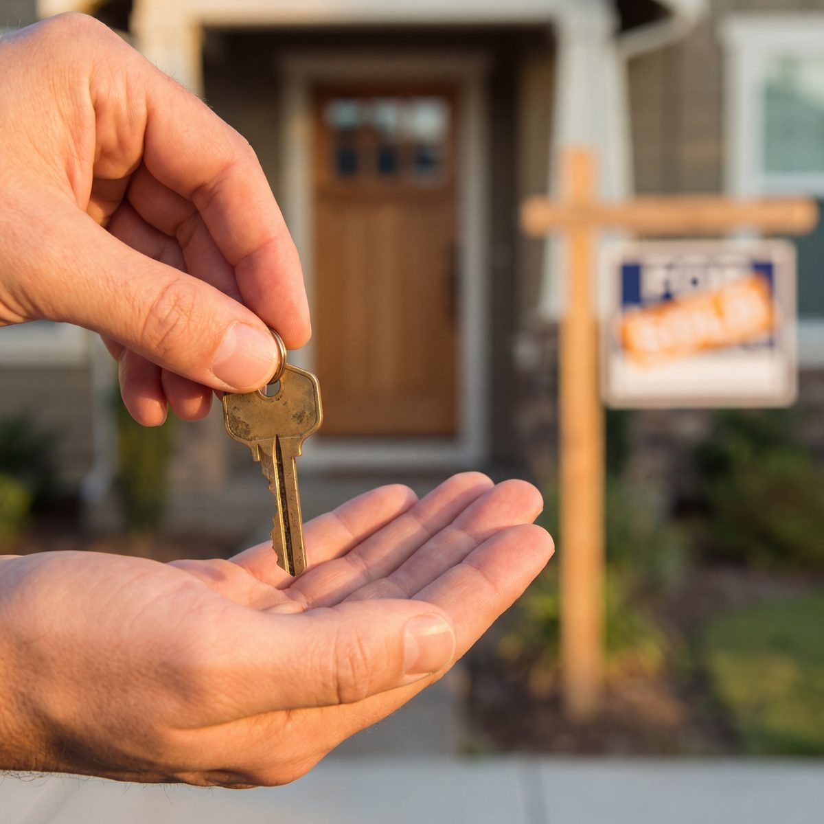 House key being handed to new homeowner